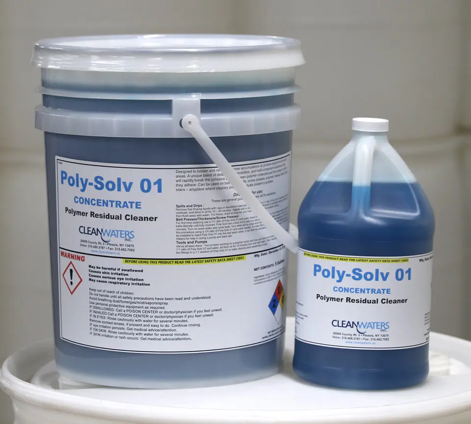 A bucket of blue paint next to a gallon of blue cleaner.