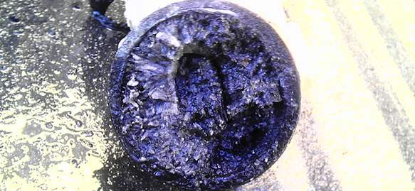 A close up of the top part of a purple object.